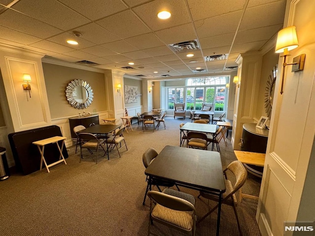 7207 Ravenscroft Rd Unit 7207, Clifton, NJ 07013 - dining area featuring carpet, a decorative wall, crown molding, recessed lighting, and a drop ceiling