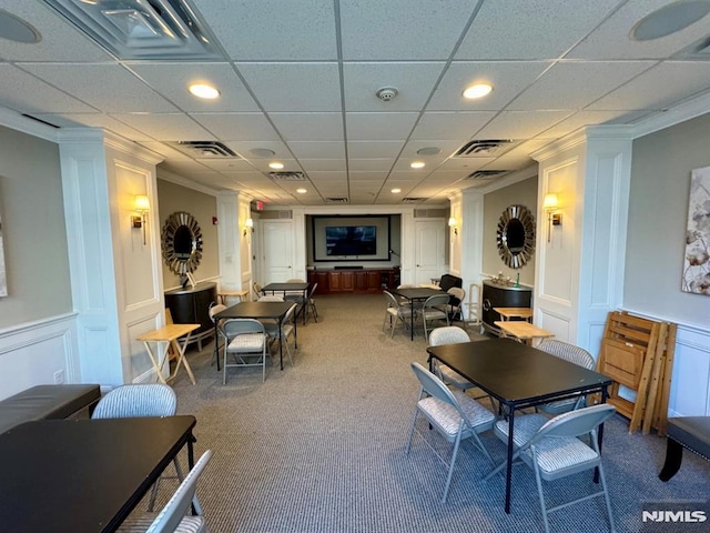 7207 Ravenscroft Rd Unit 7207, Clifton, NJ 07013 - dining area featuring a decorative wall, carpet flooring, ornamental molding, ornate columns, and a drop ceiling