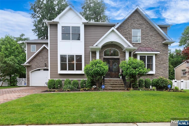 62 Merritt Ave, Cresskill, NJ 07626 - view of front of property with stone siding, decorative driveway, and french doors