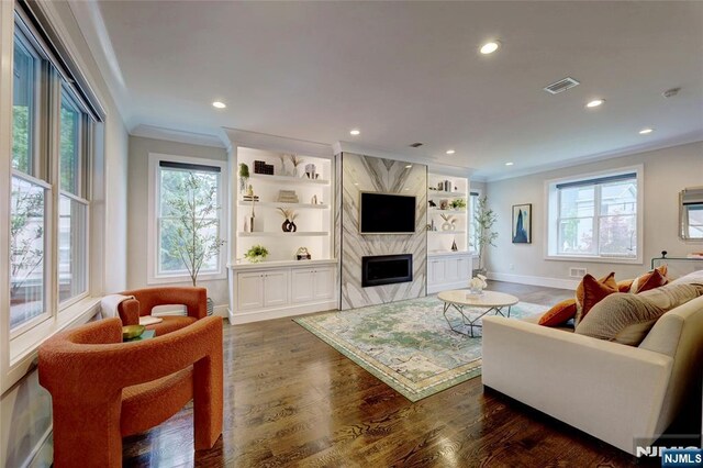 62 Merritt Ave, Cresskill, NJ 07626 - living room featuring crown molding, wood finished floors, plenty of natural light, recessed lighting, and a high end fireplace