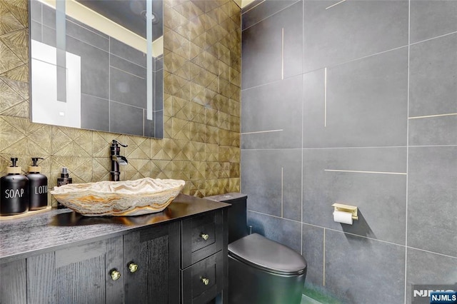 62 Merritt Ave, Cresskill, NJ 07626 - half bath with tile walls, vanity, and tasteful backsplash