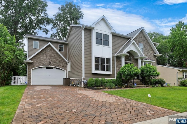 62 Merritt Ave, Cresskill, NJ 07626 - craftsman-style home featuring stone siding, decorative driveway, and a gate