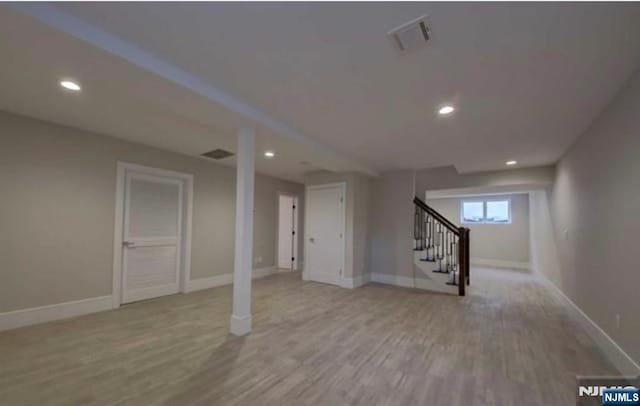 62 Merritt Ave, Cresskill, NJ 07626 - below grade area featuring stairway, wood finished floors, and recessed lighting