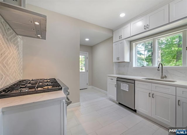 126 Grant Ave, Cresskill, NJ 07626 - kitchen featuring appliances with stainless steel finishes, tasteful backsplash, recessed lighting, white cabinets, and light stone countertops