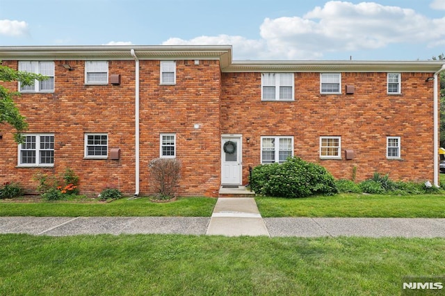 1245 Valley Rd Unit B, Wayne, NJ 07470 - view of front of home with a front lawn and brick siding