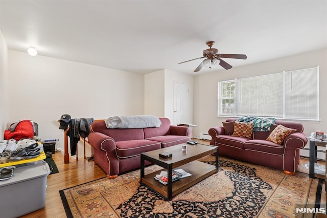 1245 Valley Rd Unit B, Wayne, NJ 07470 - living area featuring ceiling fan, wood finished floors, baseboard heating, and a baseboard radiator