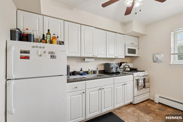 1245 Valley Rd Unit B, Wayne, NJ 07470 - kitchen with white appliances, a baseboard heating unit, a ceiling fan, and white cabinetry