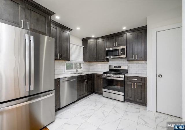 69 Lorraine Dr, Clifton, NJ 07012 - kitchen with stainless steel appliances, light marble finish floors, backsplash, and recessed lighting