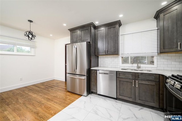 69 Lorraine Dr, Clifton, NJ 07012 - kitchen with appliances with stainless steel finishes, light stone countertops, backsplash, dark brown cabinets, and recessed lighting