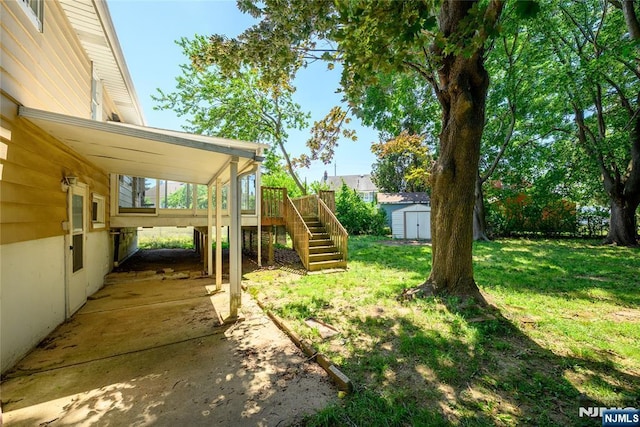 69 Lorraine Dr, Clifton, NJ 07012 - view of green lawn with stairway, a shed, and a wooden deck
