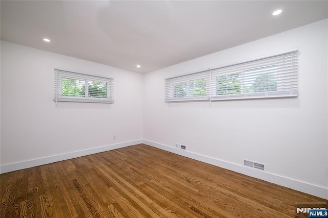 69 Lorraine Dr, Clifton, NJ 07012 - empty room featuring healthy amount of natural light, wood finished floors, and recessed lighting
