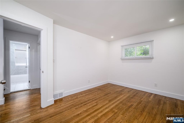 69 Lorraine Dr, Clifton, NJ 07012 - unfurnished room with wood finished floors and recessed lighting