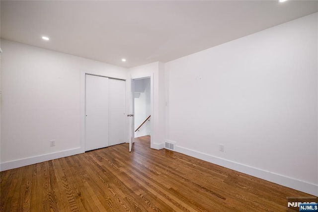 69 Lorraine Dr, Clifton, NJ 07012 - unfurnished bedroom featuring wood finished floors, recessed lighting, and a closet