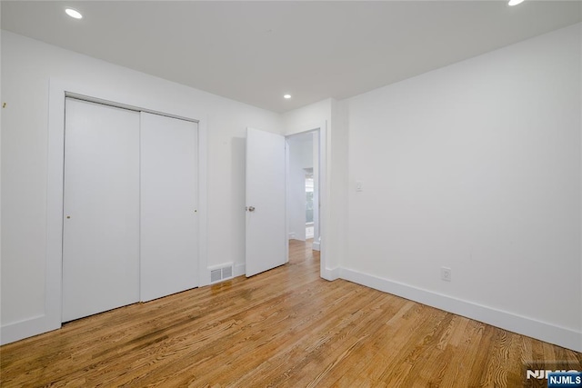 69 Lorraine Dr, Clifton, NJ 07012 - unfurnished bedroom featuring light wood-type flooring, recessed lighting, and a closet