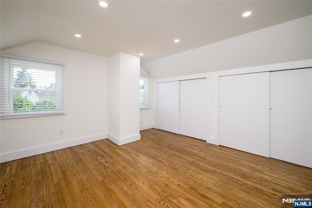69 Lorraine Dr, Clifton, NJ 07012 - unfurnished bedroom with two closets, lofted ceiling, wood finished floors, and recessed lighting