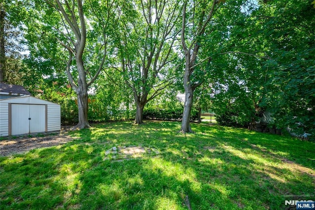 69 Lorraine Dr, Clifton, NJ 07012 - view of grassy yard featuring a storage shed