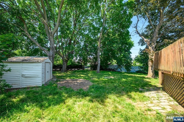 69 Lorraine Dr, Clifton, NJ 07012 - fenced backyard with a storage unit