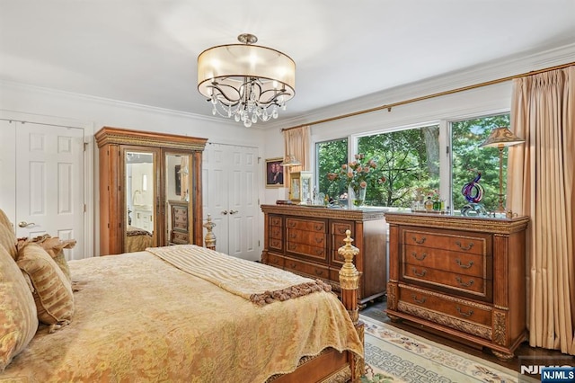 15 Barberry Way, Essex Fells, NJ 07021 - bedroom featuring a chandelier, multiple closets, and crown molding