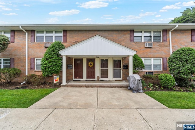 141 N Maple Ave Unit 141, Park Ridge, NJ 07656 - townhome / multi-family property with brick siding and a porch