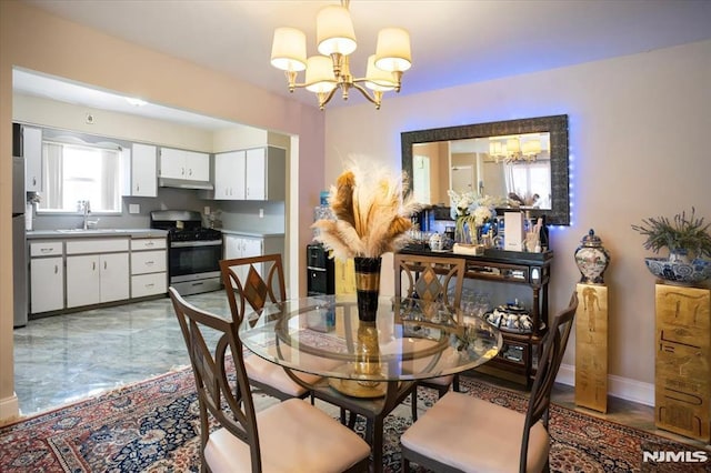 131 Shaler Ave, Fairview, NJ 07022 - dining area featuring a chandelier and baseboards