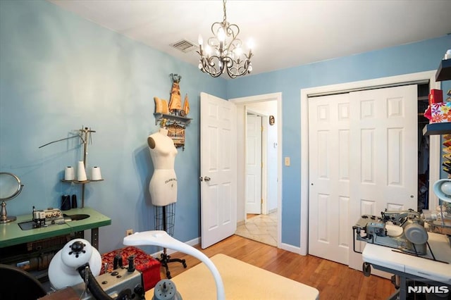 131 Shaler Ave, Fairview, NJ 07022 - bathroom with a chandelier and wood finished floors