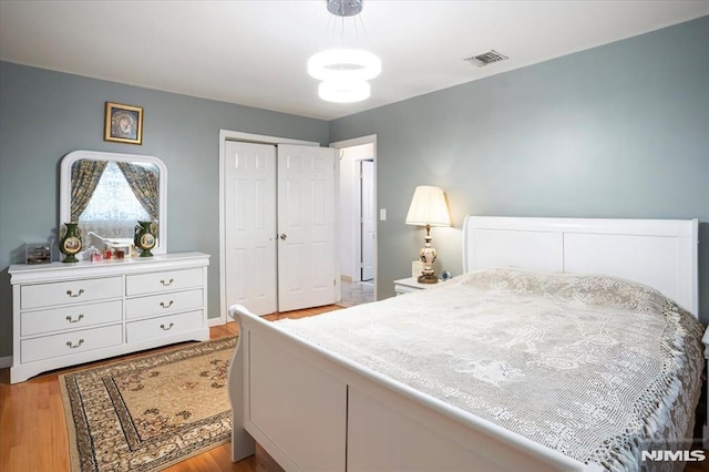 131 Shaler Ave, Fairview, NJ 07022 - bedroom with light wood-type flooring and a closet