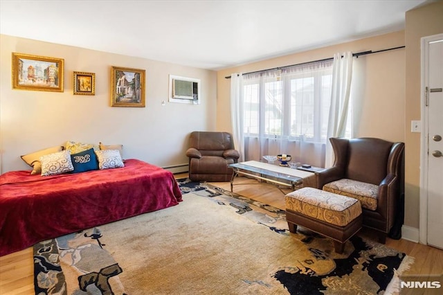 131 Shaler Ave, Fairview, NJ 07022 - bedroom with wood finished floors and a wall mounted AC