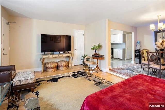 131 Shaler Ave, Fairview, NJ 07022 - living room with a chandelier and wood finished floors