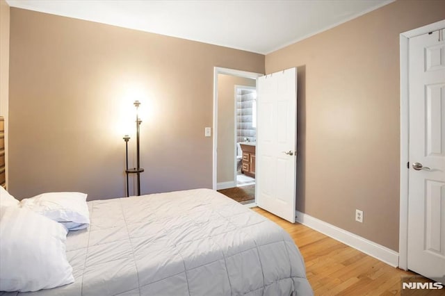 131 Shaler Ave, Fairview, NJ 07022 - bedroom featuring light wood-style flooring and ornamental molding
