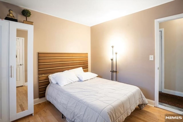 131 Shaler Ave, Fairview, NJ 07022 - bedroom with light wood-style floors and baseboards
