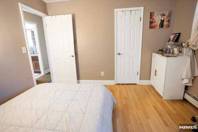 131 Shaler Ave, Fairview, NJ 07022 - bedroom featuring light wood finished floors and a baseboard radiator