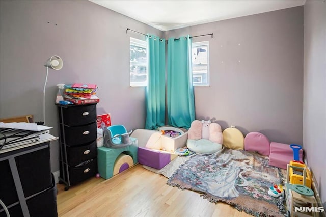 131 Shaler Ave, Fairview, NJ 07022 - playroom with wood finished floors