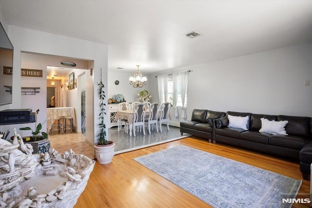 131 Shaler Ave, Fairview, NJ 07022 - living area with a chandelier and wood finished floors