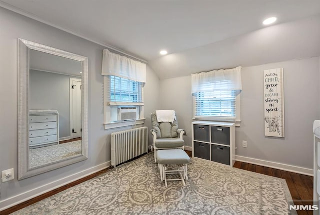 821 Glen Ave, Ridgewood, NJ 07450 - living area with radiator, wood finished floors, cooling unit, vaulted ceiling, and recessed lighting