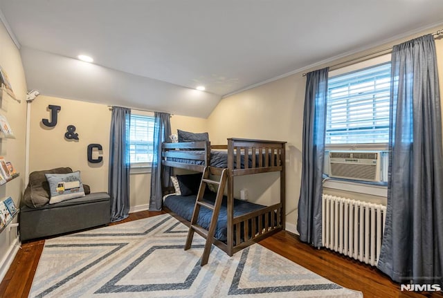 821 Glen Ave, Ridgewood, NJ 07450 - bedroom with radiator, cooling unit, wood finished floors, lofted ceiling, and ornamental molding