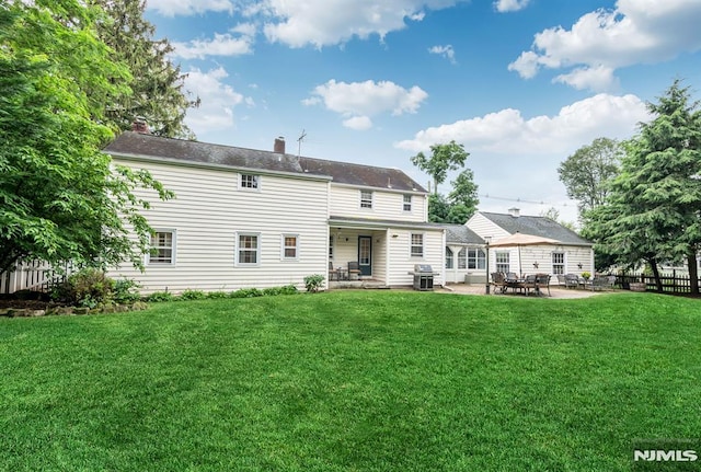 821 Glen Ave, Ridgewood, NJ 07450 - rear view of house with a patio and a chimney