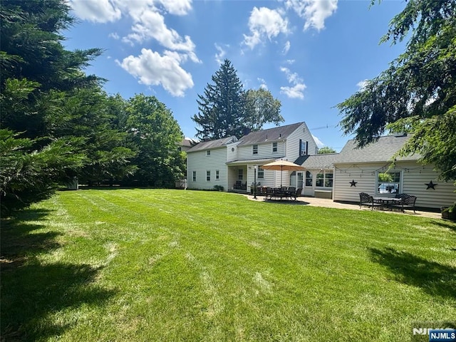 821 Glen Ave, Ridgewood, NJ 07450 - rear view of property featuring a patio area and a yard