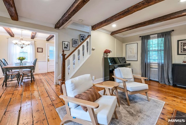 821 Glen Ave, Ridgewood, NJ 07450 - living area featuring light wood-style flooring, radiator heating unit, stairway, crown molding, and beam ceiling