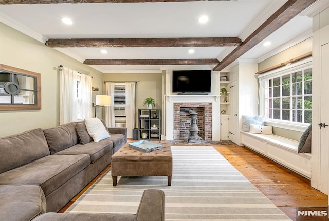 821 Glen Ave, Ridgewood, NJ 07450 - living area with hardwood / wood-style floors, beamed ceiling, crown molding, recessed lighting, and a wood stove