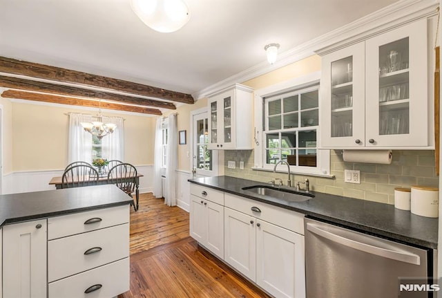 821 Glen Ave, Ridgewood, NJ 07450 - kitchen with stainless steel dishwasher, dark countertops, dark wood finished floors, beamed ceiling, and tasteful backsplash
