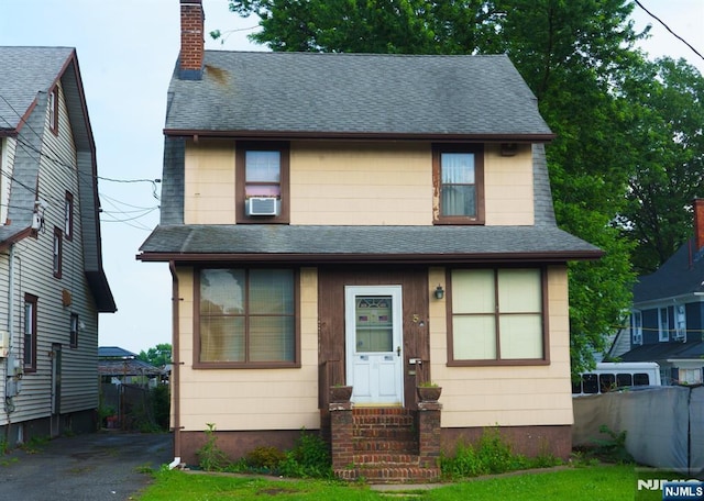 5 Grove St, Bloomfield, NJ 07003 - view of front of home with roof with shingles, a chimney, and cooling unit