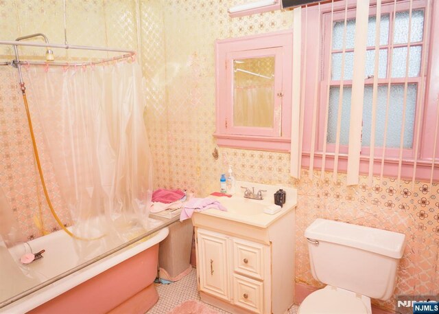 5 Grove St, Bloomfield, NJ 07003 - bathroom featuring vanity, shower / bathtub combination with curtain, and wallpapered walls