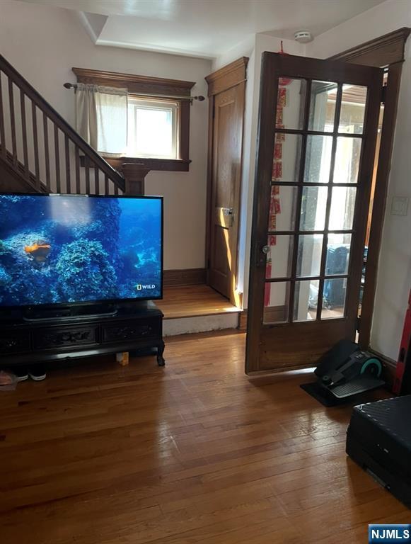 114 Hillside Ave, Teaneck, NJ 07666 - living room featuring hardwood / wood-style flooring and stairway