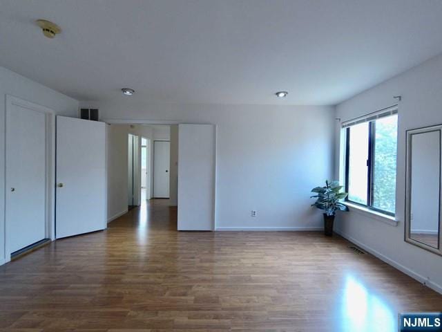 380 Whimbrel Ln Unit 380, Secaucus, NJ 07094 - spare room featuring wood finished floors and a smoke detector