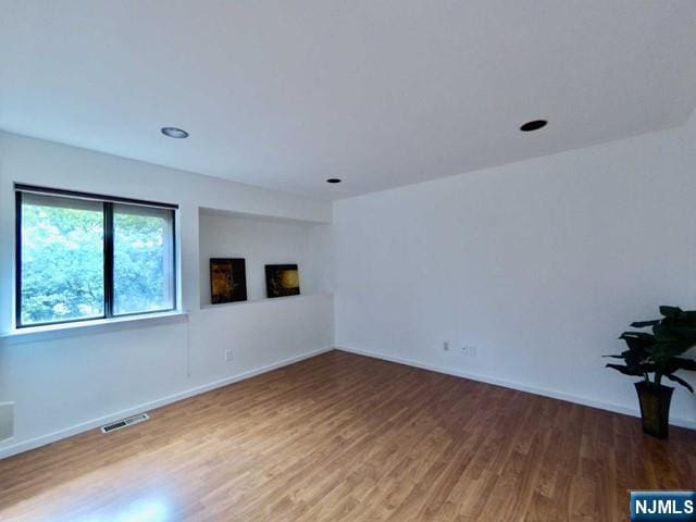 380 Whimbrel Ln Unit 380, Secaucus, NJ 07094 - empty room with wood finished floors and baseboards