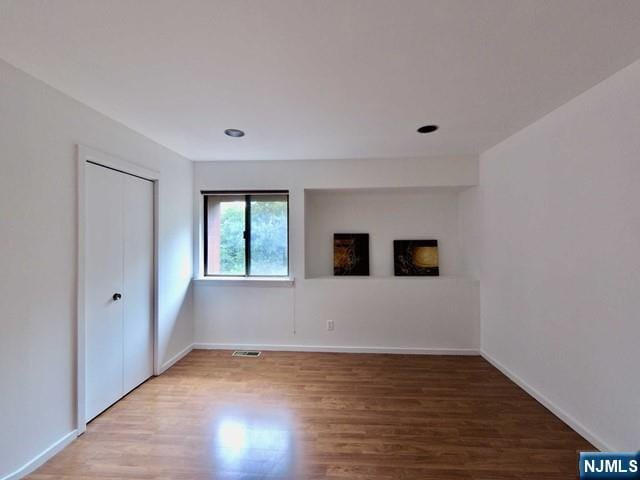 380 Whimbrel Ln Unit 380, Secaucus, NJ 07094 - unfurnished bedroom featuring light wood-type flooring and a closet