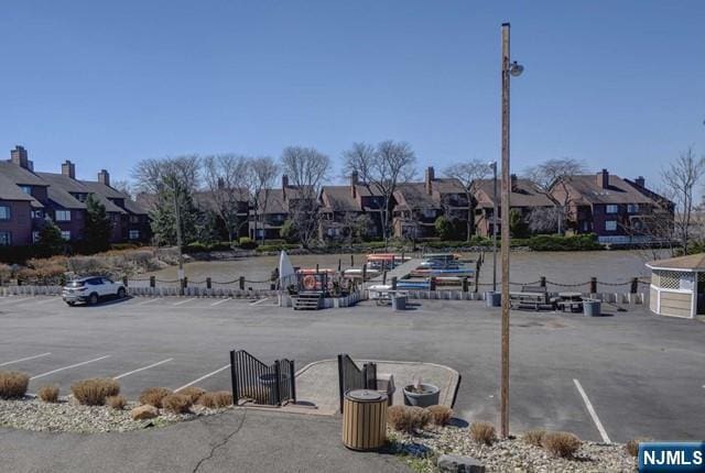 380 Whimbrel Ln Unit 380, Secaucus, NJ 07094 - uncovered parking lot featuring a residential view