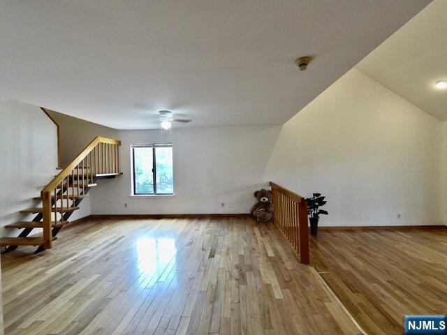 380 Whimbrel Ln Unit 380, Secaucus, NJ 07094 - unfurnished living room featuring wood-type flooring and a ceiling fan