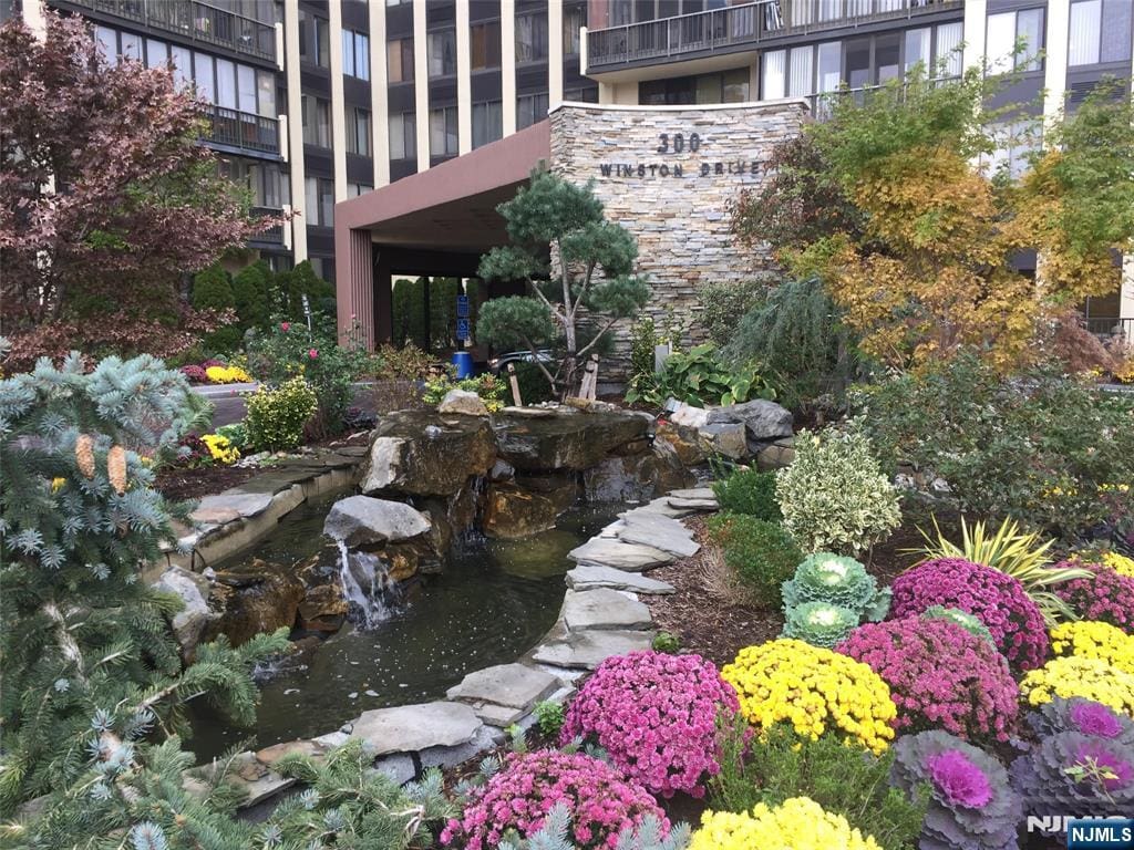 300 Winston Dr Unit C2802, Cliffside Park, NJ 07010 - view of yard with a garden pond