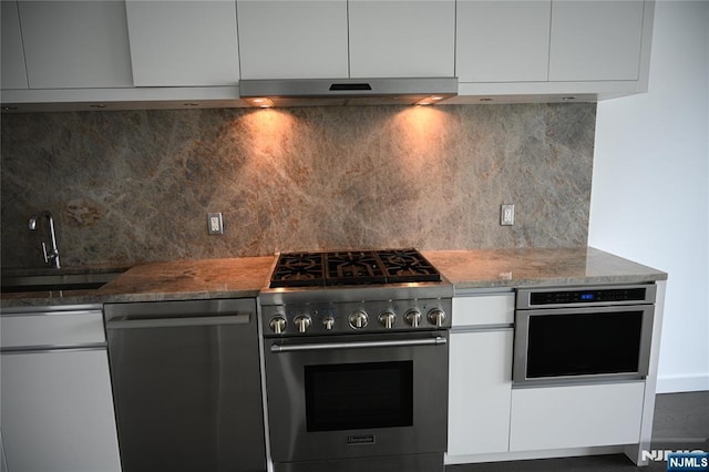 320 Adolphus Ave Unit 422, Cliffside Park, NJ 07010 - kitchen with stainless steel appliances, range hood, modern cabinets, white cabinets, and backsplash